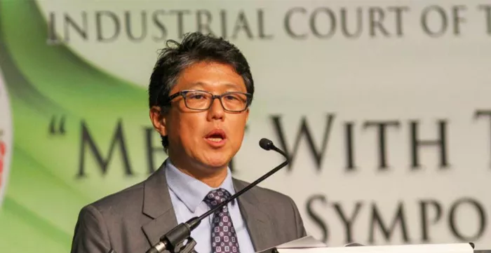 Photo of Shingo Miyake, ILO Labour Law and International Standards Specialist addressing the symposium